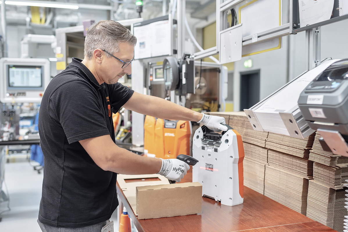 A man is scanning a product